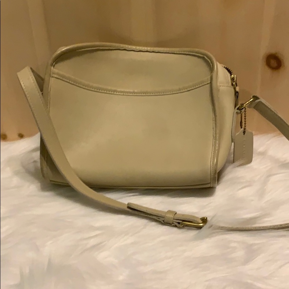 Coach cream-colored leather crossbody